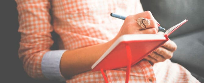 woman writing in journal