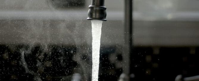 faucet running in kitchen