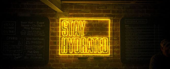 Neon sign on wall Stay Hydrated