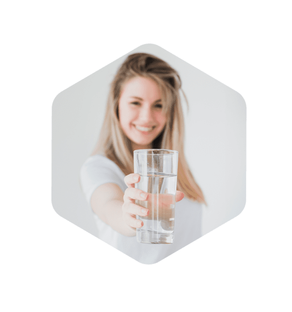 woman holding glass of water